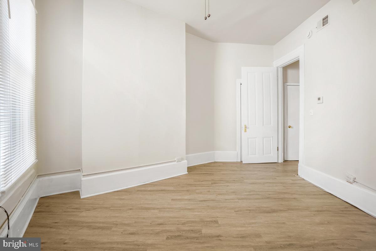 471 Florida Avenue Northwest, Unit 1 Washington, DC 20001 - Photo 30 of 39 a view of an empty room with wooden floor