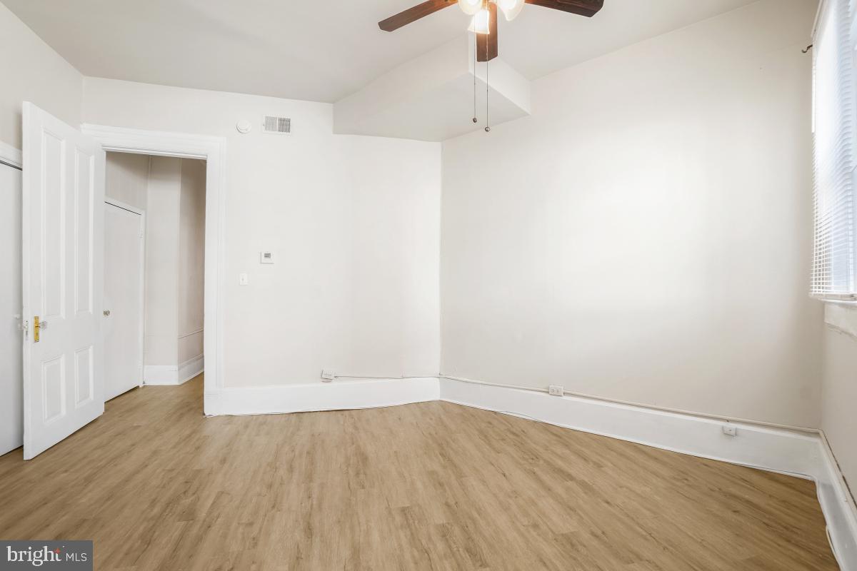 471 Florida Avenue Northwest, Unit 1 Washington, DC 20001 - Photo 32 of 39 an empty room with wooden floor cabinet and closet