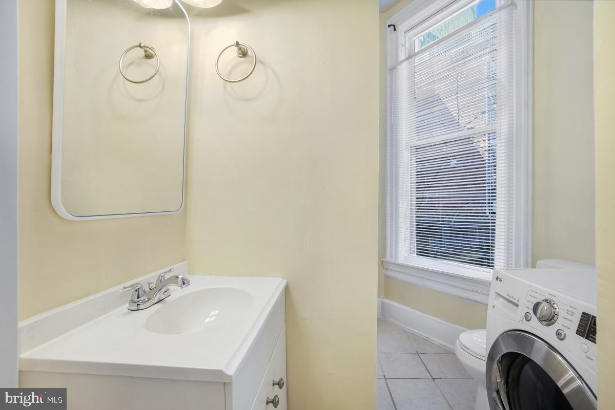 471 Florida Avenue Northwest, Unit 1 Washington, DC 20001 - Photo 35 of 39 a bathroom with a sink and a vanity