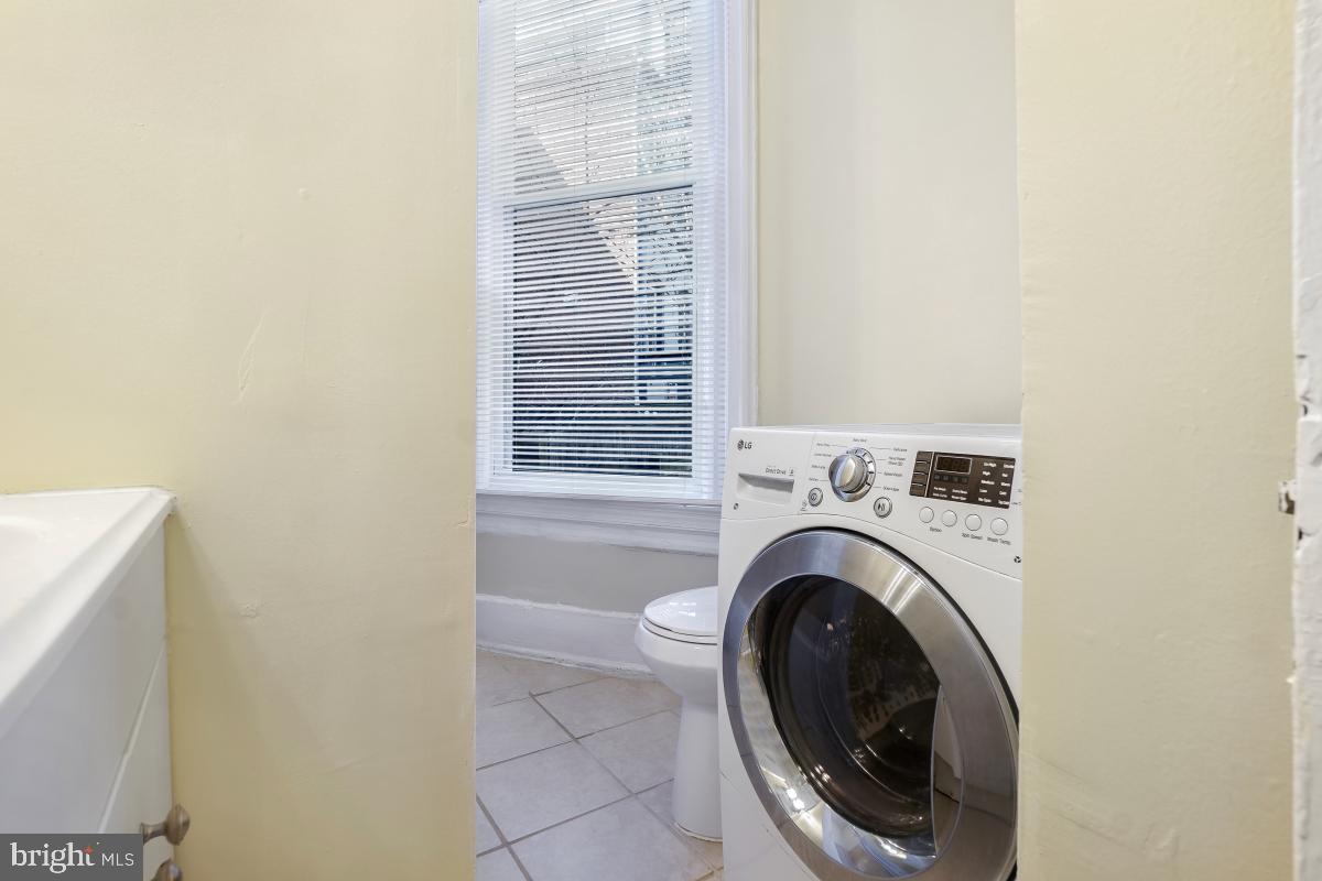 471 Florida Avenue Northwest, Unit 1 Washington, DC 20001 - Photo 36 of 39 a view of a hallway with washer and dryer