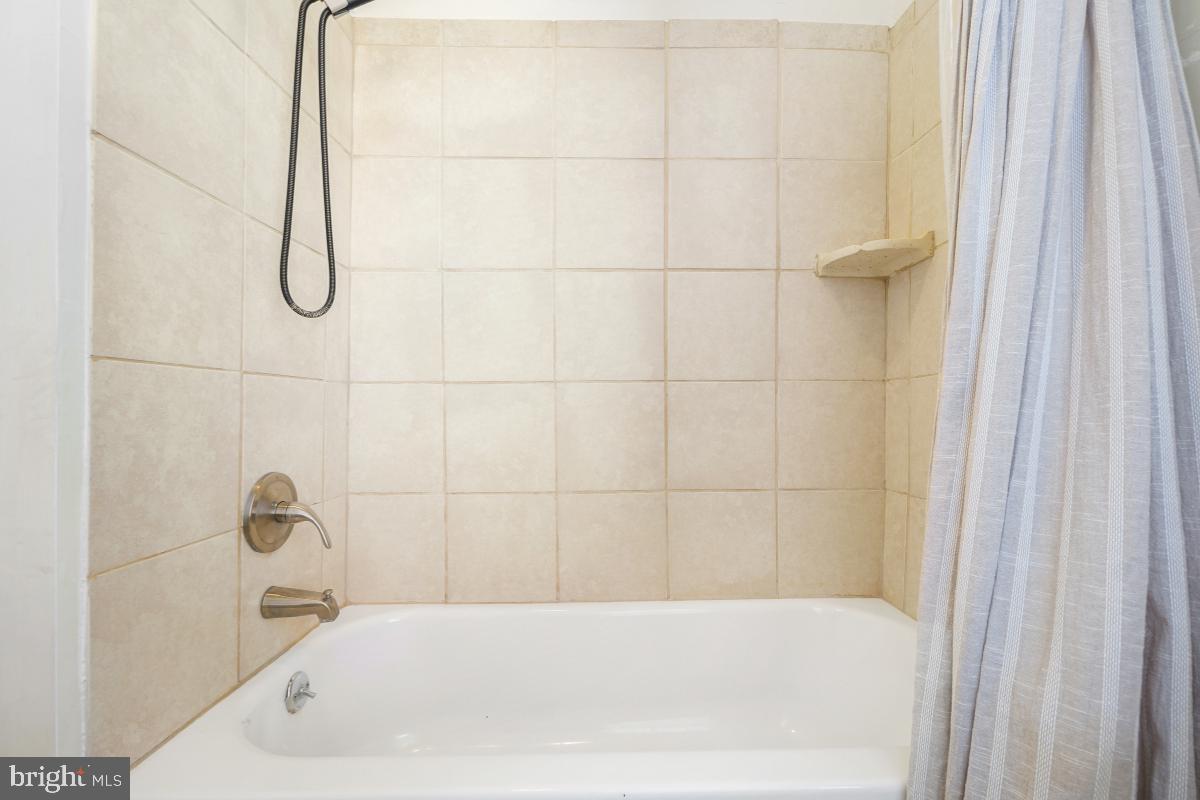 471 Florida Avenue Northwest, Unit 1 Washington, DC 20001 - Photo 38 of 39 a bathroom with a bath tub