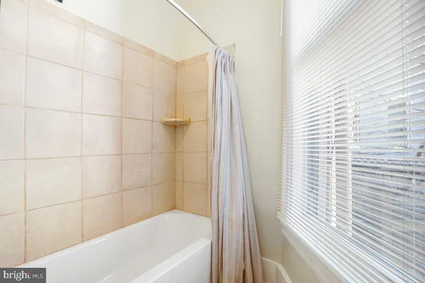 a view of a bathroom from a corridor