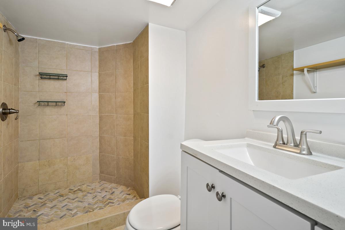 471 Florida Avenue Northwest, Unit 1 Washington, DC 20001 - Photo 5 of 39 a bathroom with a sink toilet and shower