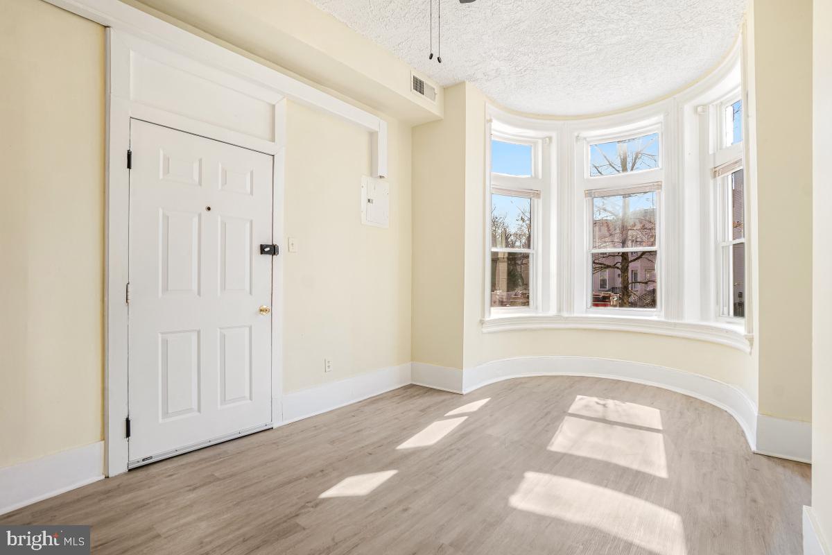 471 Florida Avenue Northwest, Unit 1 Washington, DC 20001 - Photo 8 of 39 a view of a room with wooden floor and windows