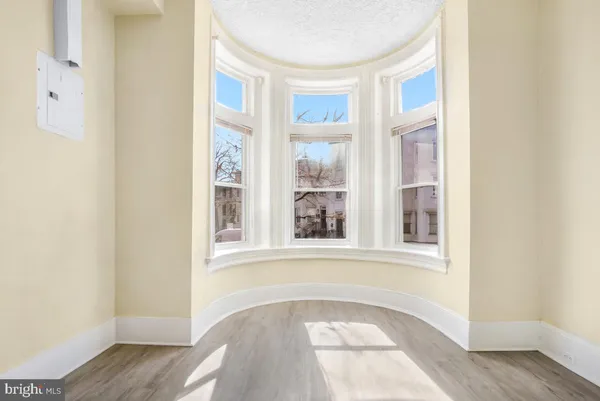 a view of a room with cabinet and a ceiling fan