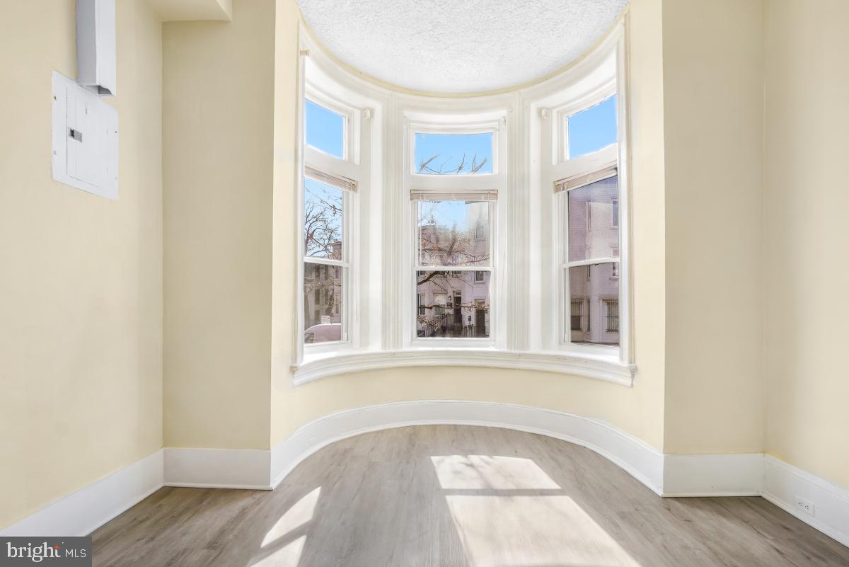 471 Florida Avenue Northwest, Unit 1 Washington, DC 20001 - Photo 9 of 39 an empty room with wooden floor and windows