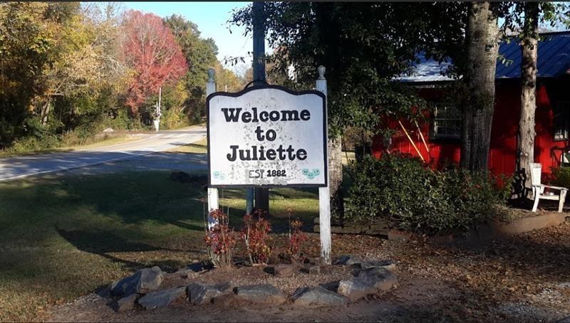 1047 Ponder Trammell Road Juliette, GA 31046 - Photo 5 of 8 a sign on the side of the road