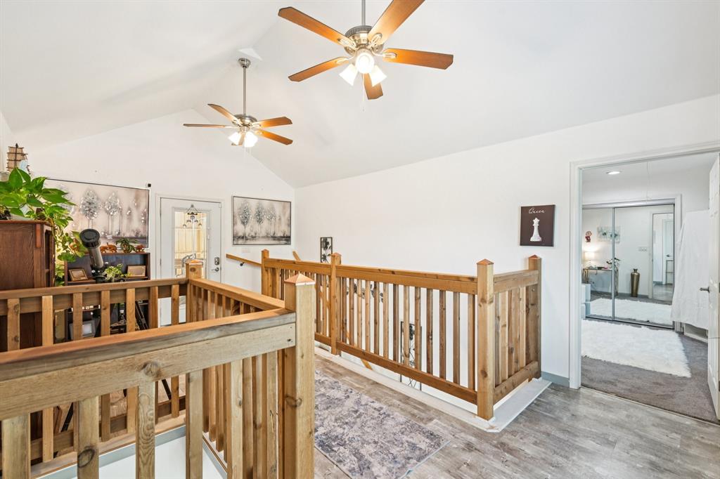 169 Chisam Road Valley View, TX 76272 - Photo 15 of 37 a view of staircase with furniture and a chandelier