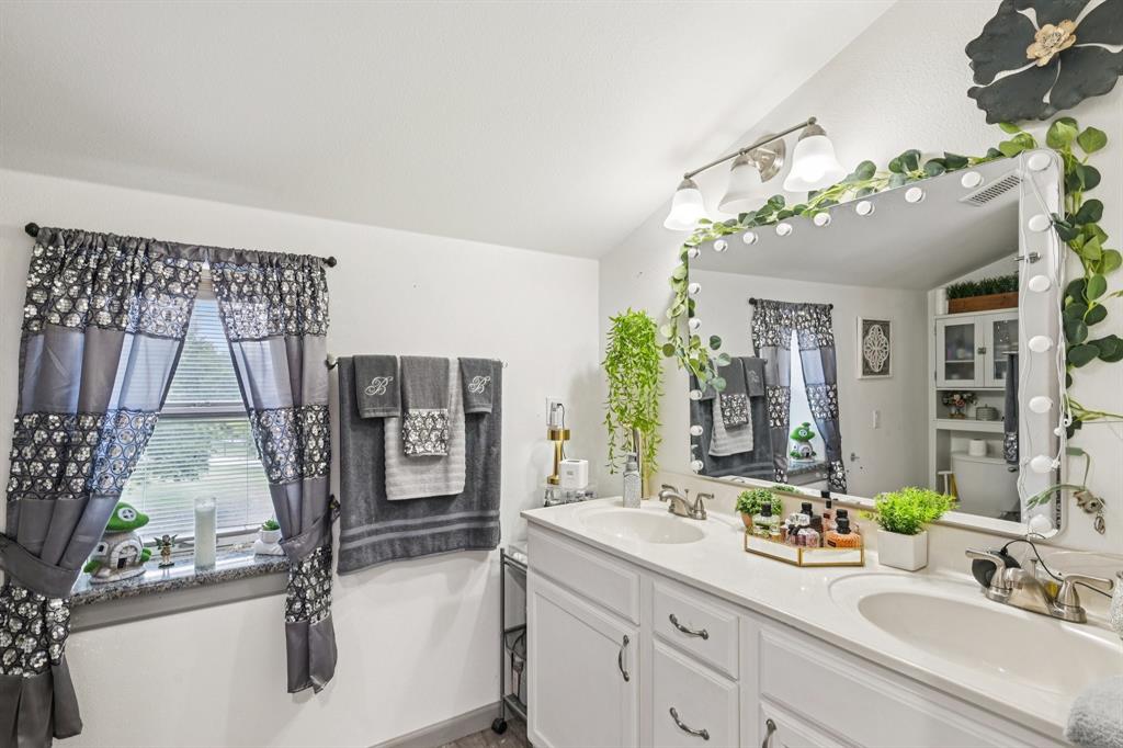 169 Chisam Road Valley View, TX 76272 - Photo 21 of 37 a bathroom with a sink and a mirror