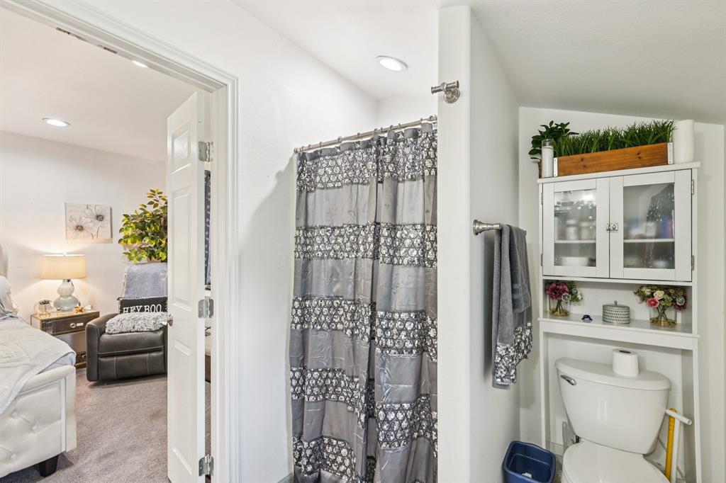 169 Chisam Road Valley View, TX 76272 - Photo 23 of 37 a bathroom with a sink toilet and shower