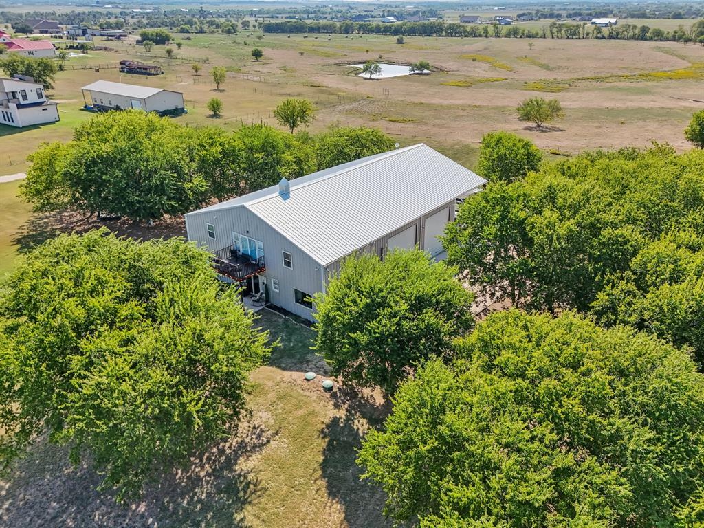 169 Chisam Road Valley View, TX 76272 - Photo 34 of 37 an aerial view of a house with a lake view