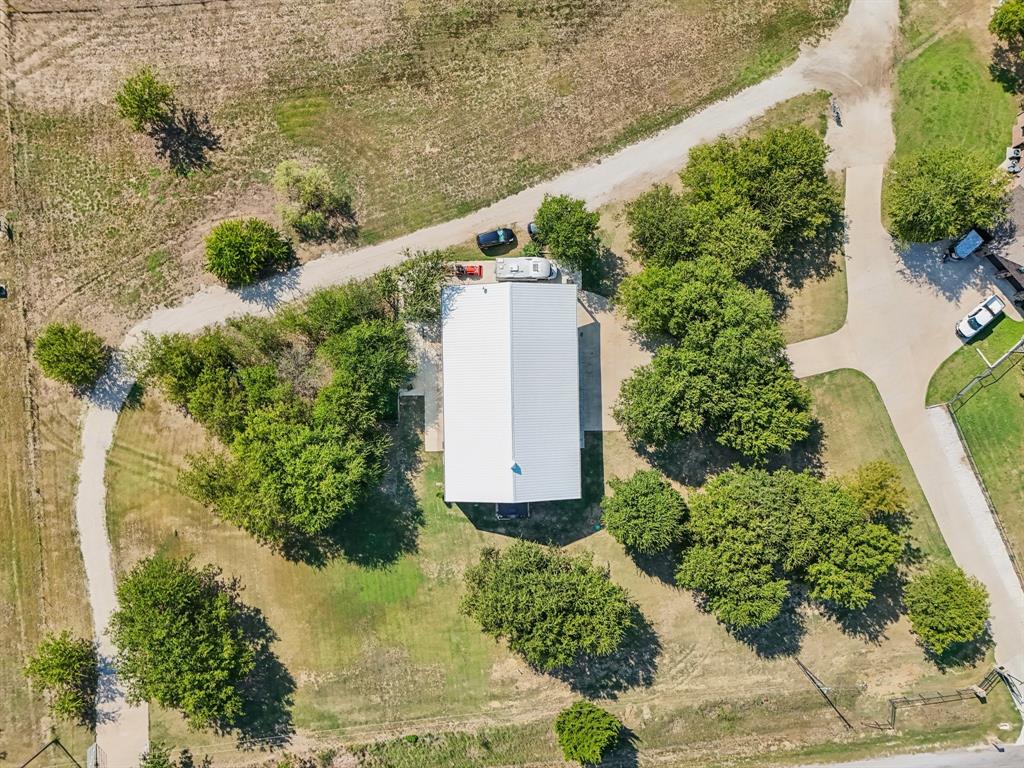 169 Chisam Road Valley View, TX 76272 - Photo 36 of 37 an aerial view of a house with a yard and large trees