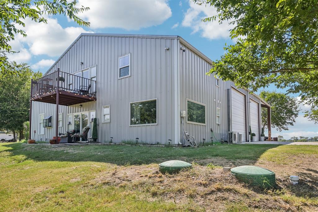 169 Chisam Road Valley View, TX 76272 - Photo 37 of 37 a view of a house with backyard and trees