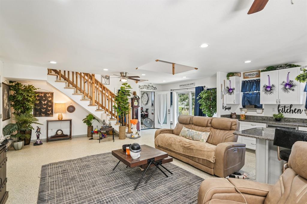 169 Chisam Road Valley View, TX 76272 - Photo 7 of 37 a living room with furniture or couch and a potted plant