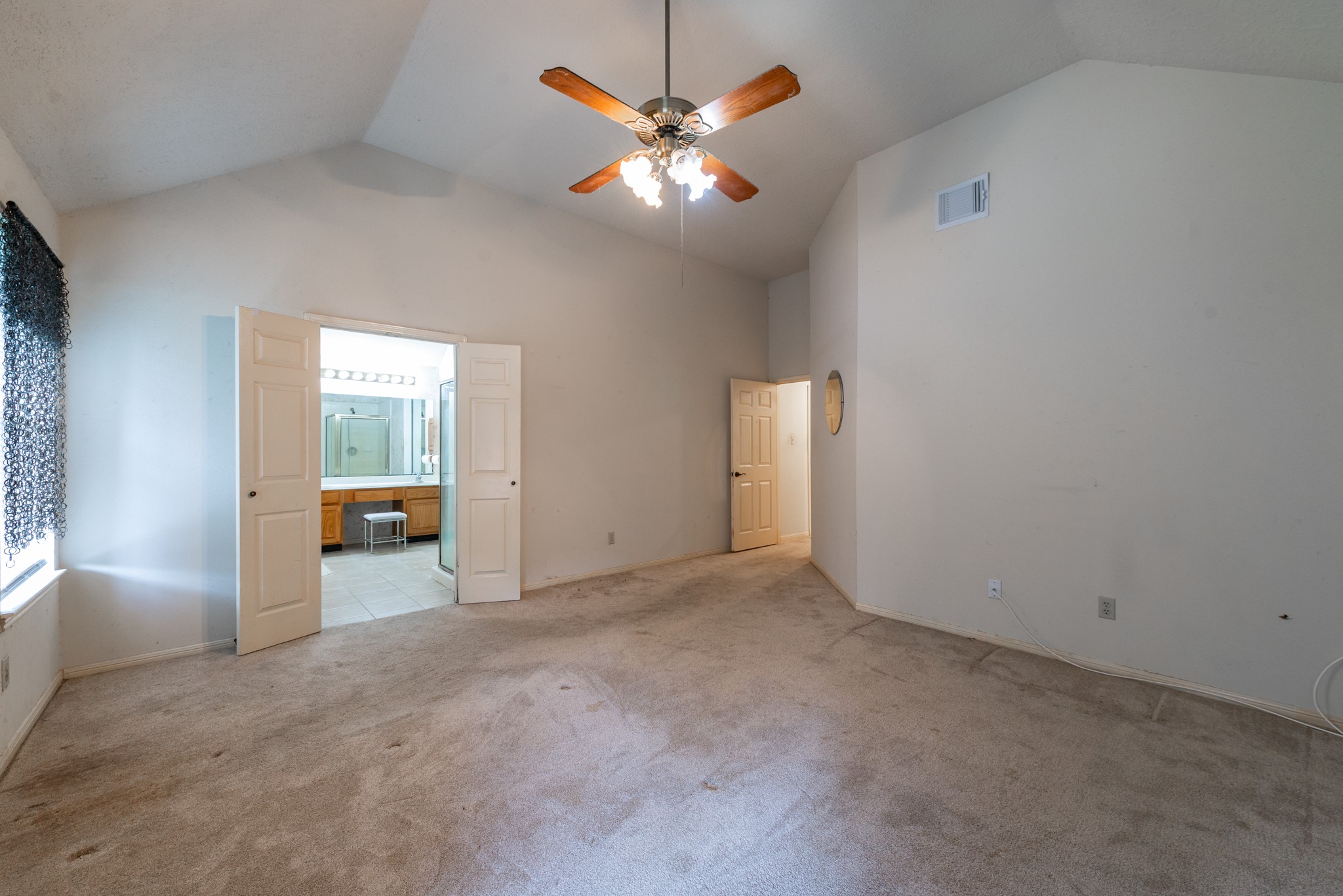12203 Canterhurst Way Houston, TX 77065 - Photo 17 of 23 an empty room with chandelier fan and windows