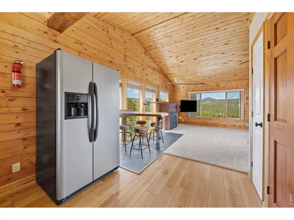a kitchen with stainless steel appliances a stove microwave and sink