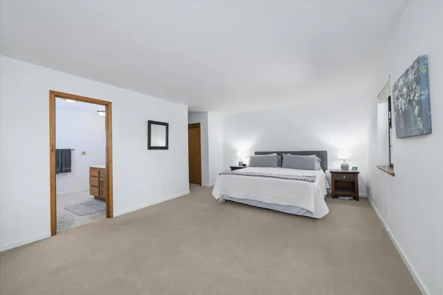 a bed room with a bed and a night lamp