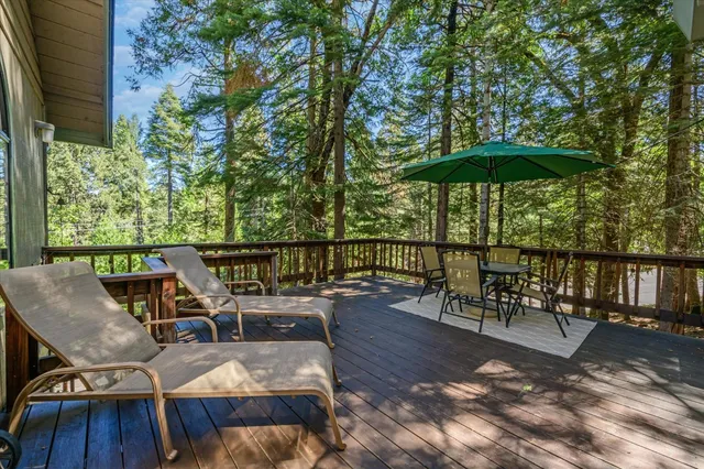 a view of a chairs and table in the patio
