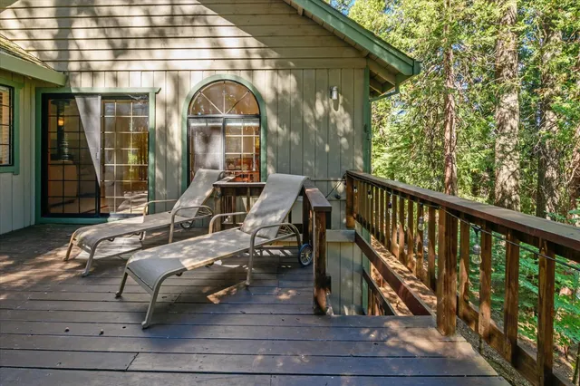 a view of porch with wooden floor