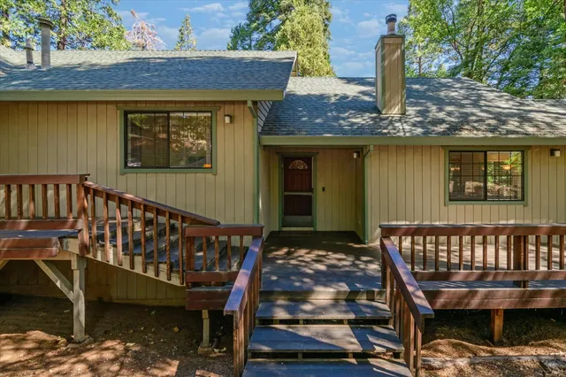 a view of a wooden deck with a bench