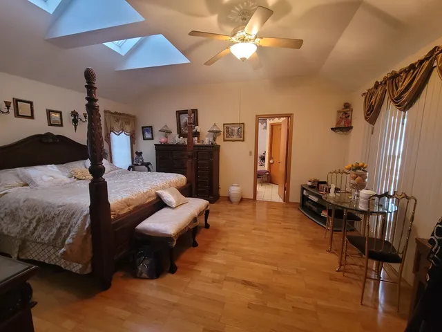 a living room with furniture a ceiling fan and a rug