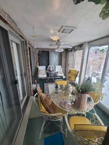 a view of a livingroom with furniture window and wooden floor