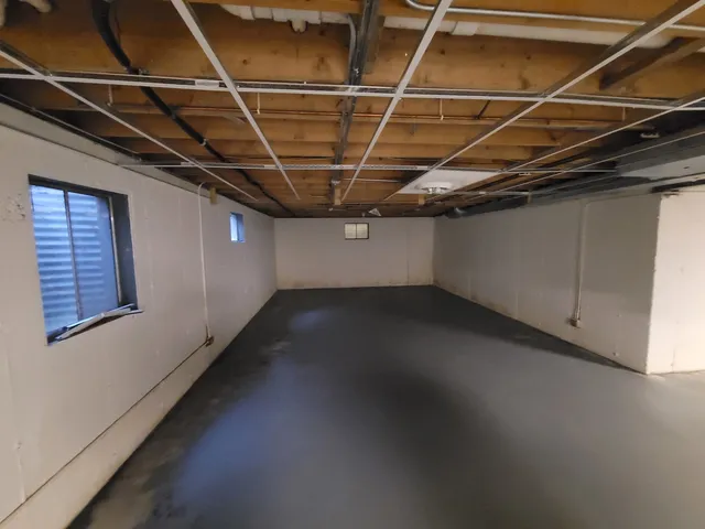 a view of a room with wooden walls