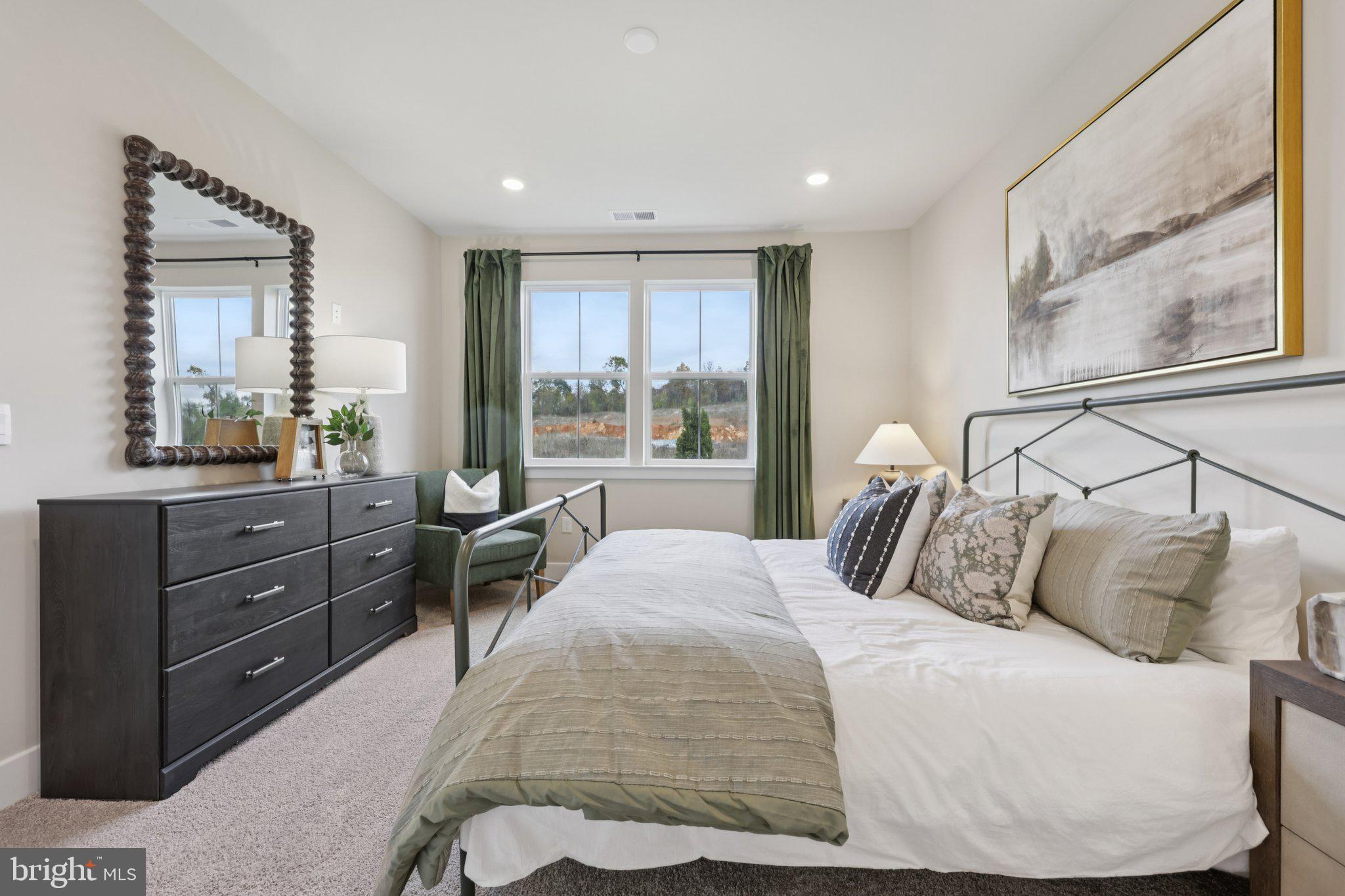 108 Trellis View Lane Winchester, VA 22602 - Photo 19 of 45 a bedroom with a bed and large windows