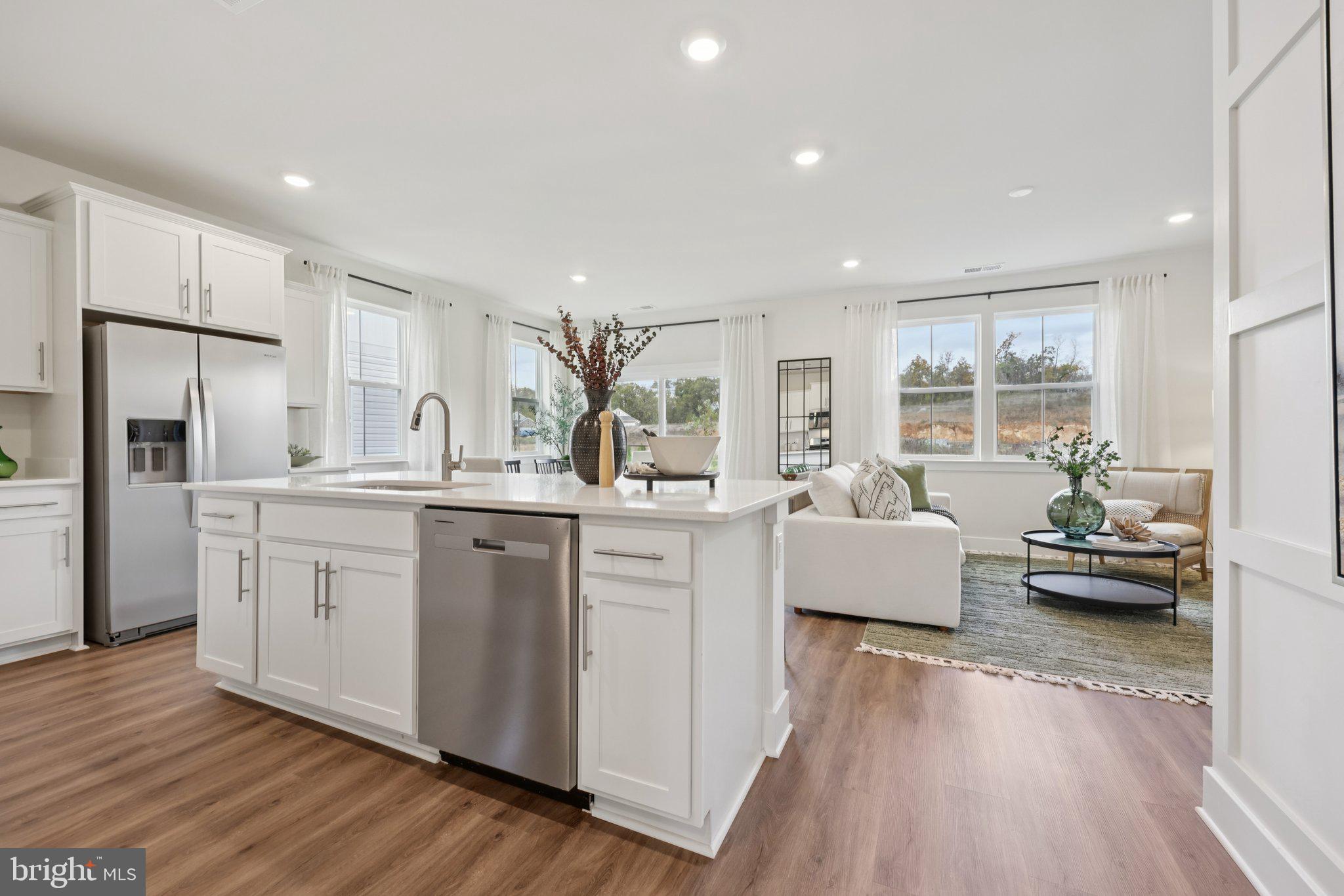 108 Trellis View Lane Winchester, VA 22602 - Photo 10 of 45 a open kitchen with white cabinets and stainless steel appliances