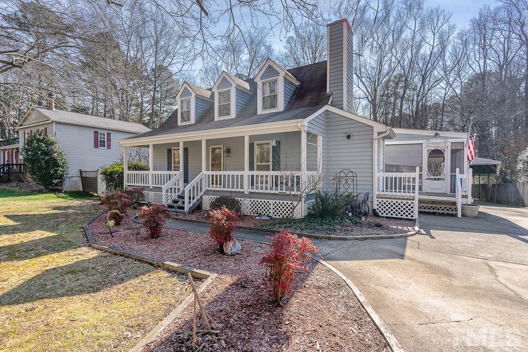 7244 Mine Shaft Road Raleigh, NC 27615 - Photo 18 of 23 a front view of a house with garden and sitting area