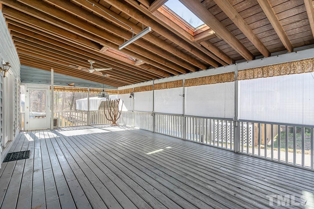 7244 Mine Shaft Road Raleigh, NC 27615 - Photo 22 of 23 a view of an empty room with wooden floor