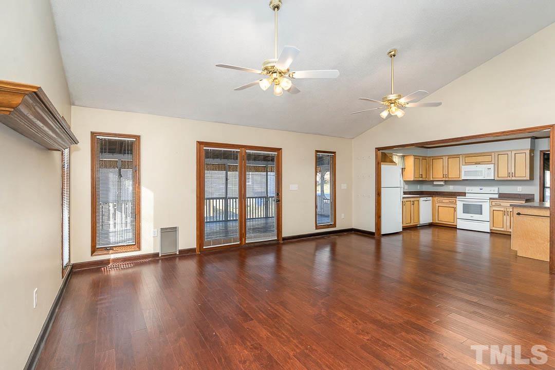 7244 Mine Shaft Road Raleigh, NC 27615 - Photo 4 of 23 a view of an empty room with wooden floor and a window