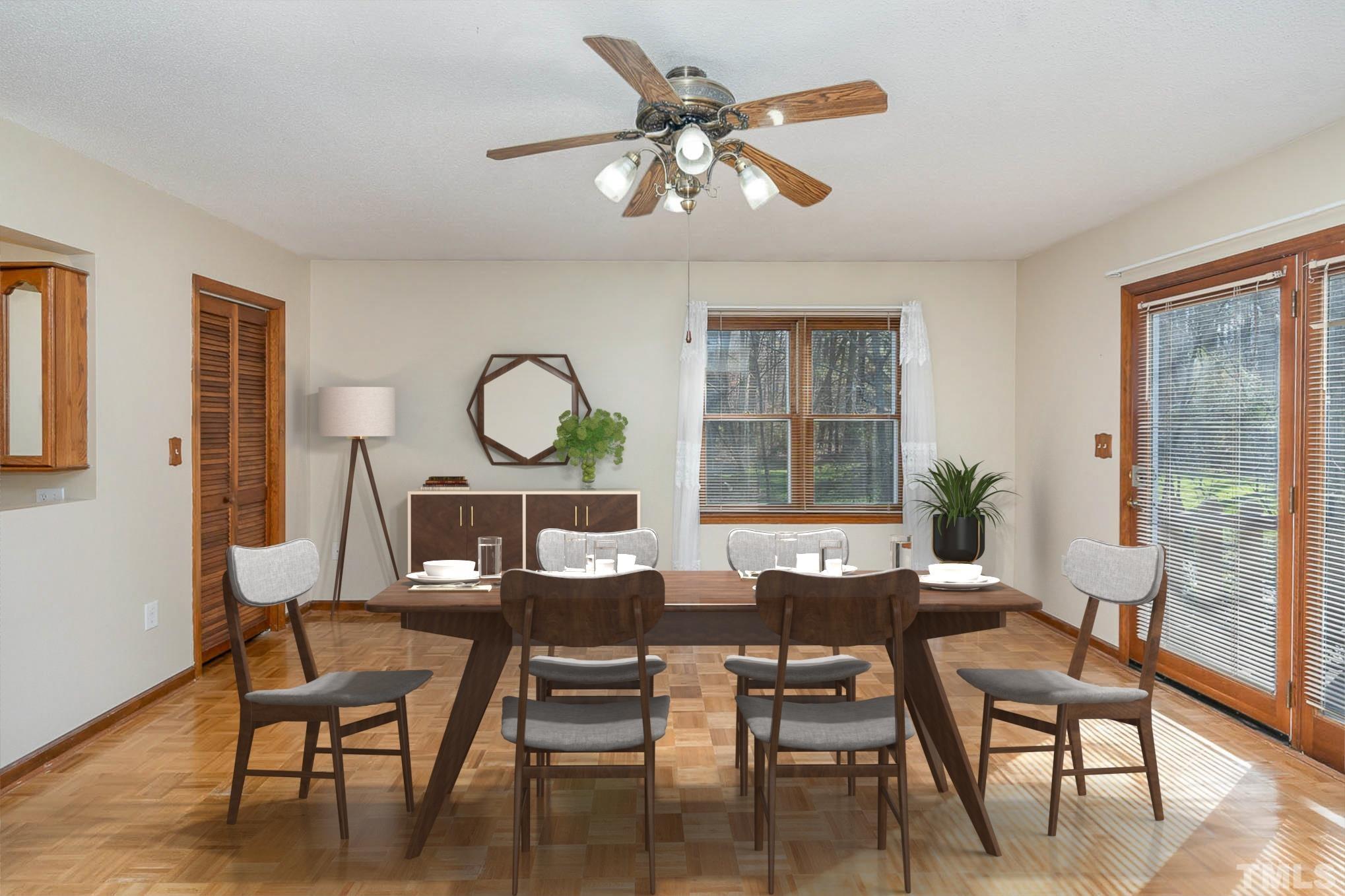 7244 Mine Shaft Road Raleigh, NC 27615 - Photo 8 of 23 a view of a dining room with furniture window and wooden floor