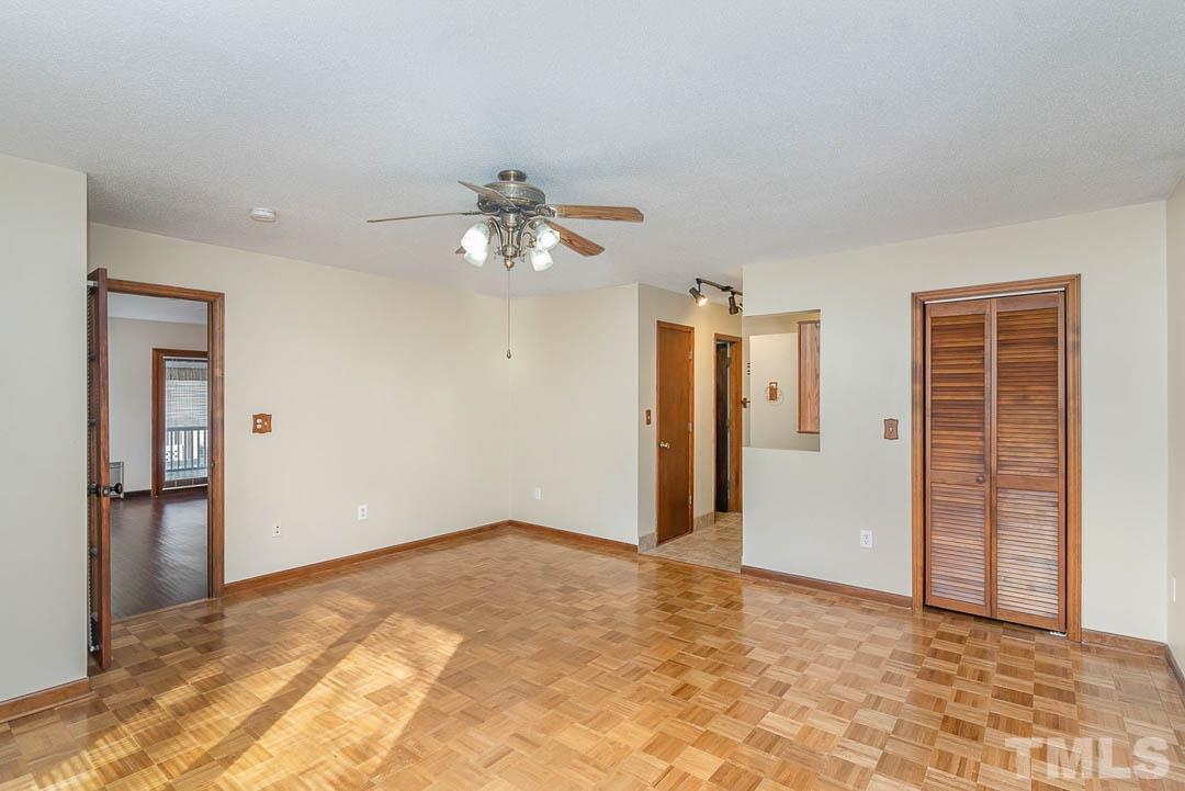 7244 Mine Shaft Road Raleigh, NC 27615 - Photo 9 of 23 an empty room with closet and mirrors