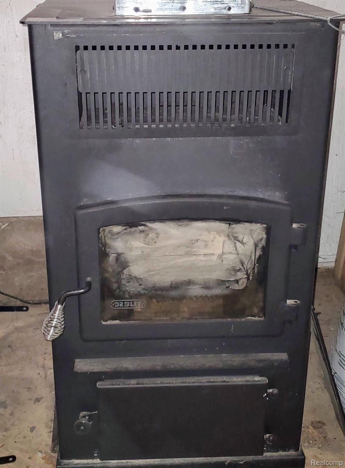 10507 Willard Road Montrose, MI 48457 - Photo 26 of 45 Newer pellet stove to help keep heating costs down