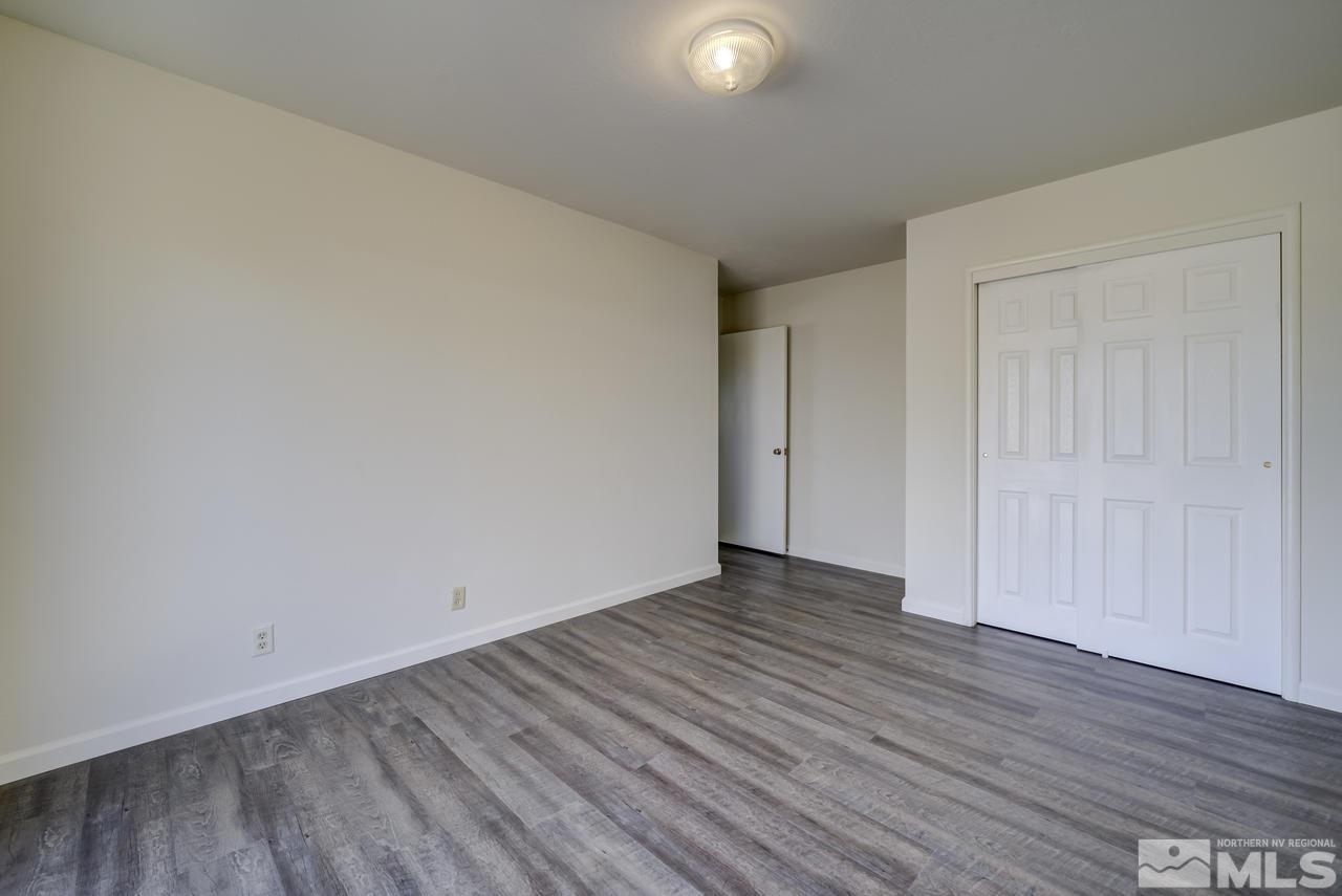 2001 Arcane Avenue Reno, NV 89503 - Photo 11 of 25 a view of an empty room with wooden floor