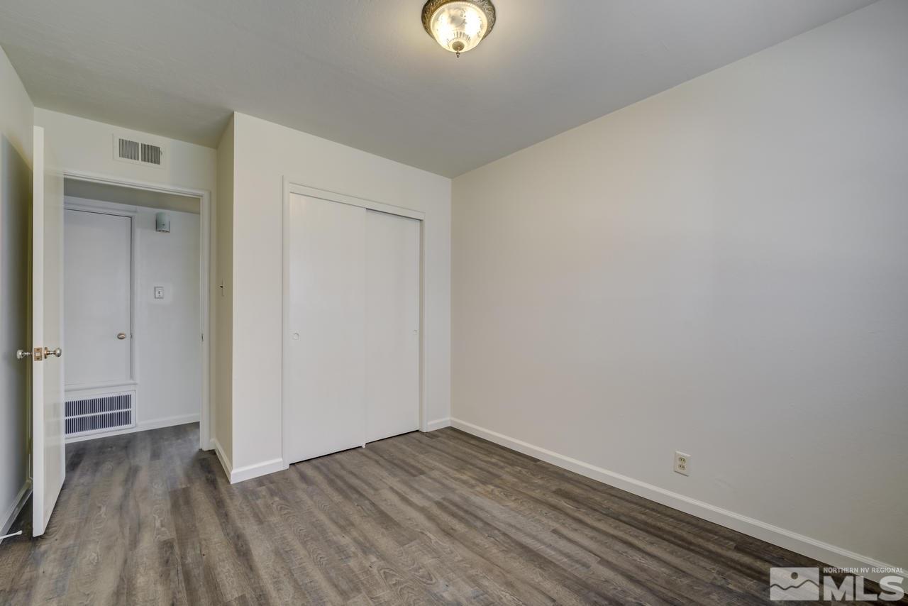 2001 Arcane Avenue Reno, NV 89503 - Photo 13 of 25 a view of empty room with wooden floor