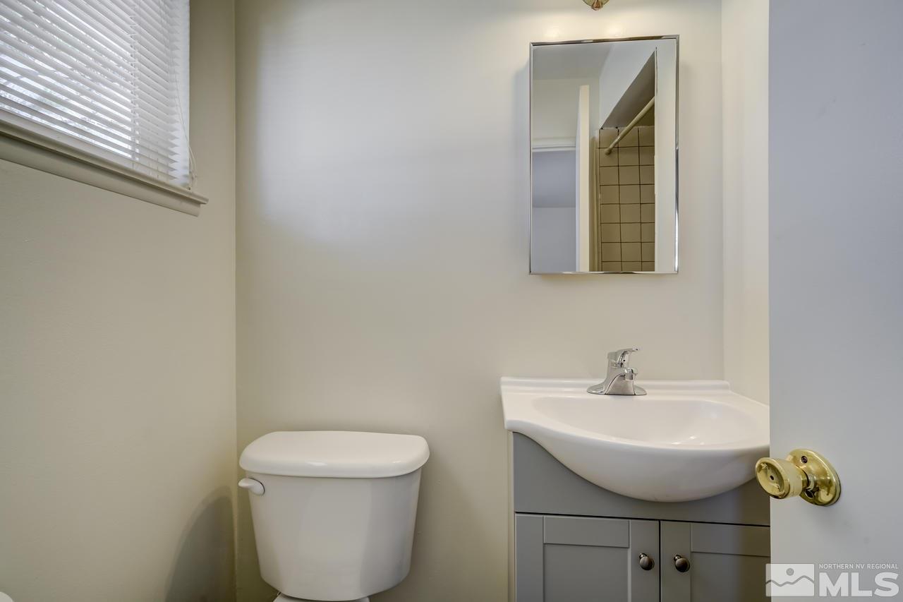 2001 Arcane Avenue Reno, NV 89503 - Photo 17 of 25 a bathroom with a toilet sink and mirror