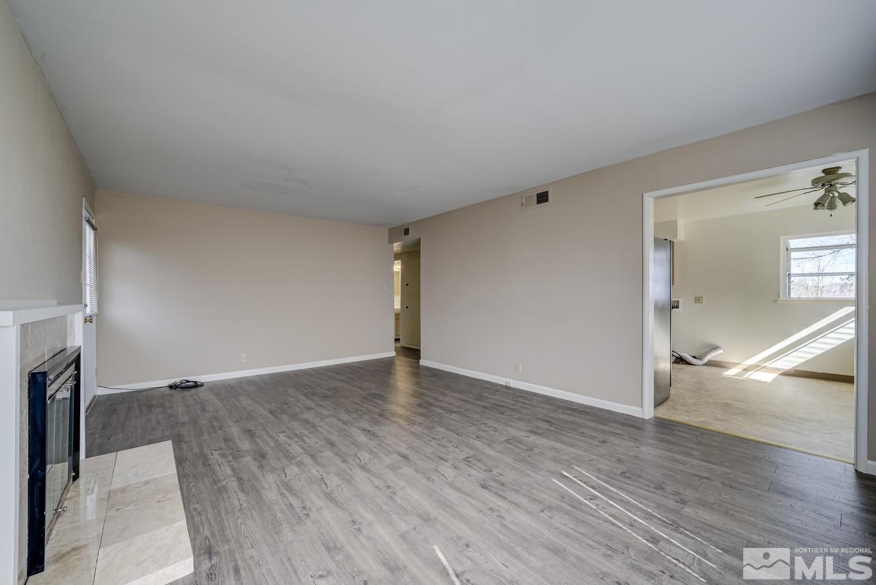 2001 Arcane Avenue Reno, NV 89503 - Photo 5 of 25 a view of empty room with wooden floor