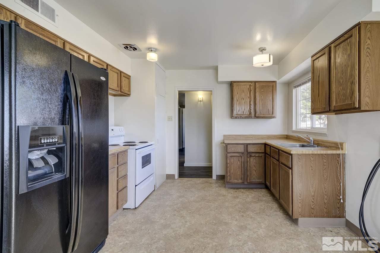 2001 Arcane Avenue Reno, NV 89503 - Photo 8 of 25 a kitchen with a refrigerator and a sink