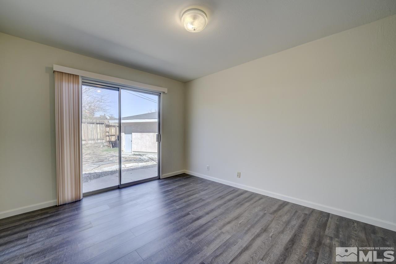 2001 Arcane Avenue Reno, NV 89503 - Photo 10 of 25 an empty room with wooden floor and windows
