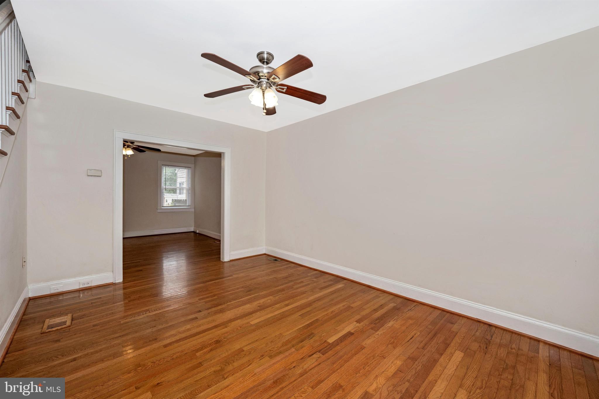 7041 Dunbar Road Dundalk, MD 21222 - Photo 5 of 28 Spacious living room with hardwood