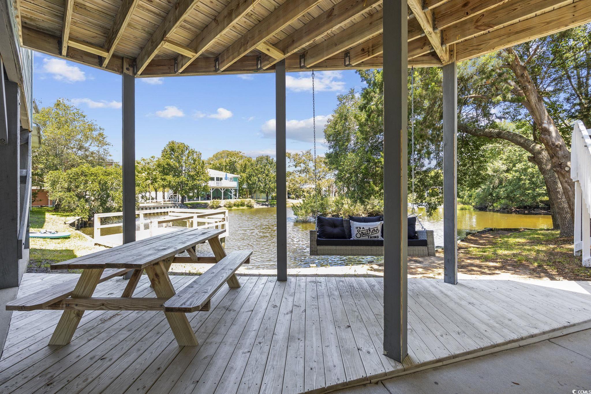 222 Calhoun Drive Murrells Inlet, SC 29576 - Photo 25 of 40 Wooden terrace with a water view