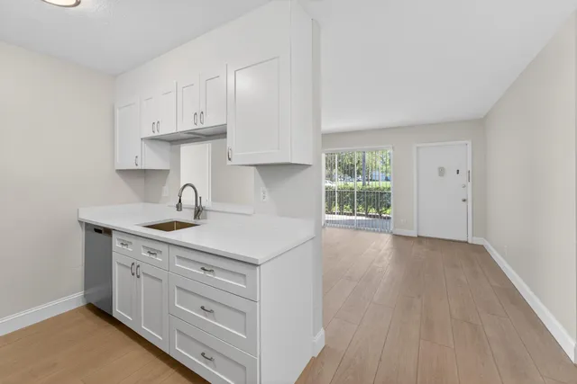 a kitchen with stainless steel appliances a refrigerator stove and microwave