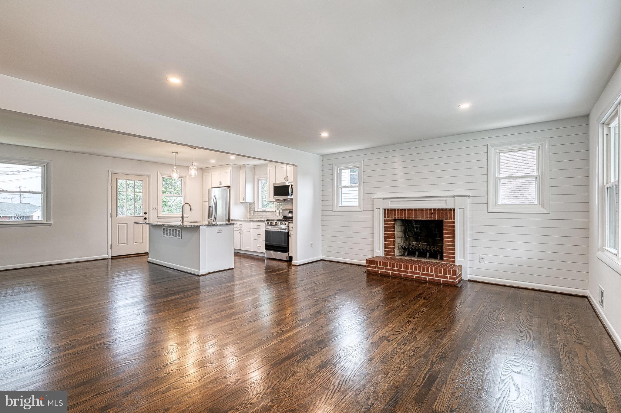2811 Willoughby Road Baltimore, MD 21234 - Photo 4 of 38 Wood burning fireplace & shiplap wall