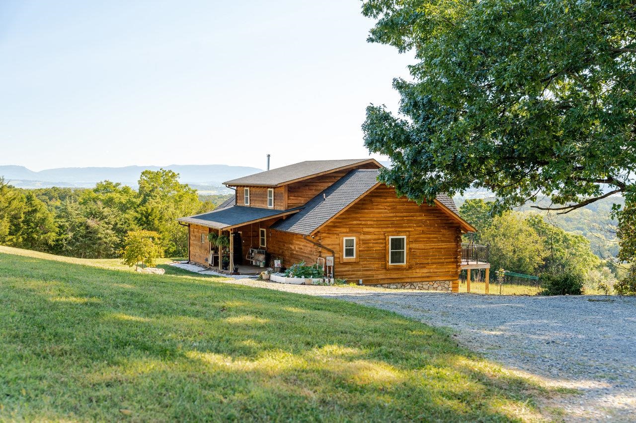 12012 Hollar School Road Linville, VA 22834 - Photo 13 of 75 a view of a house next to a big yard and large trees
