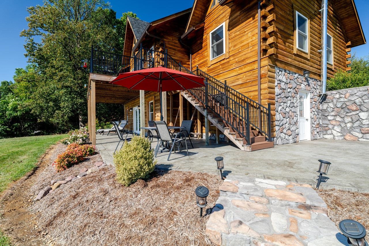 12012 Hollar School Road Linville, VA 22834 - Photo 14 of 75 a backyard of a house with a yard and seating space