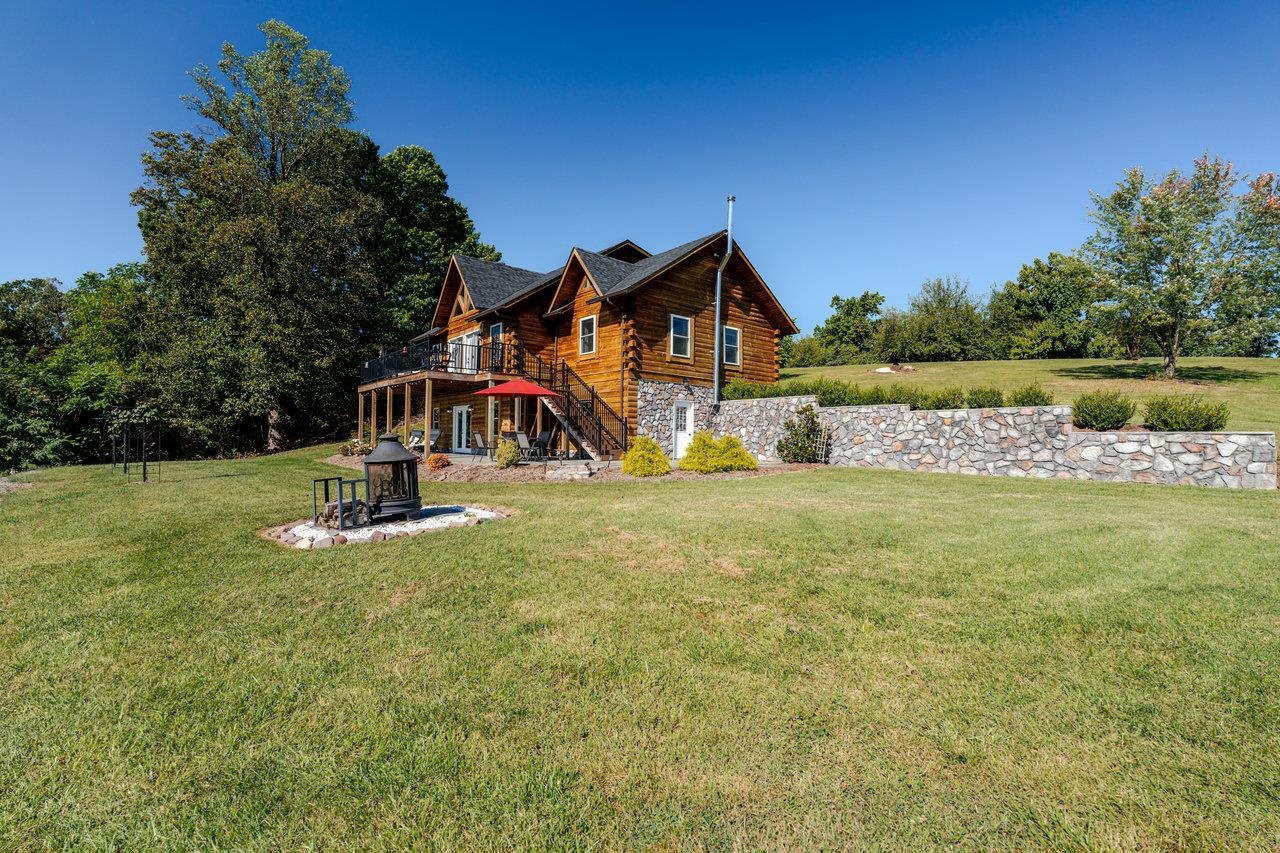 12012 Hollar School Road Linville, VA 22834 - Photo 23 of 75 a view of a house with swimming pool and a yard