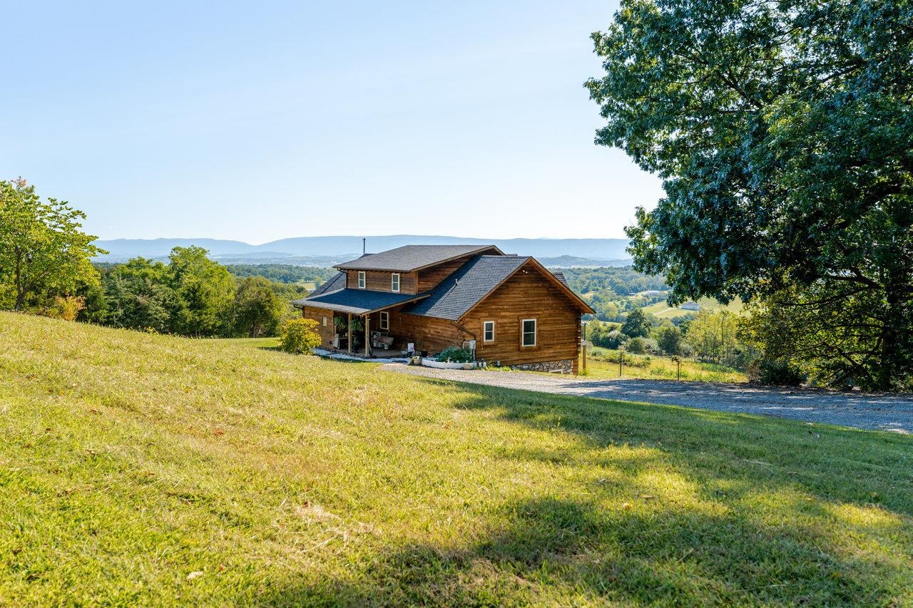 12012 Hollar School Road Linville, VA 22834 - Photo 24 of 75 a view of a house with a big yard and large trees