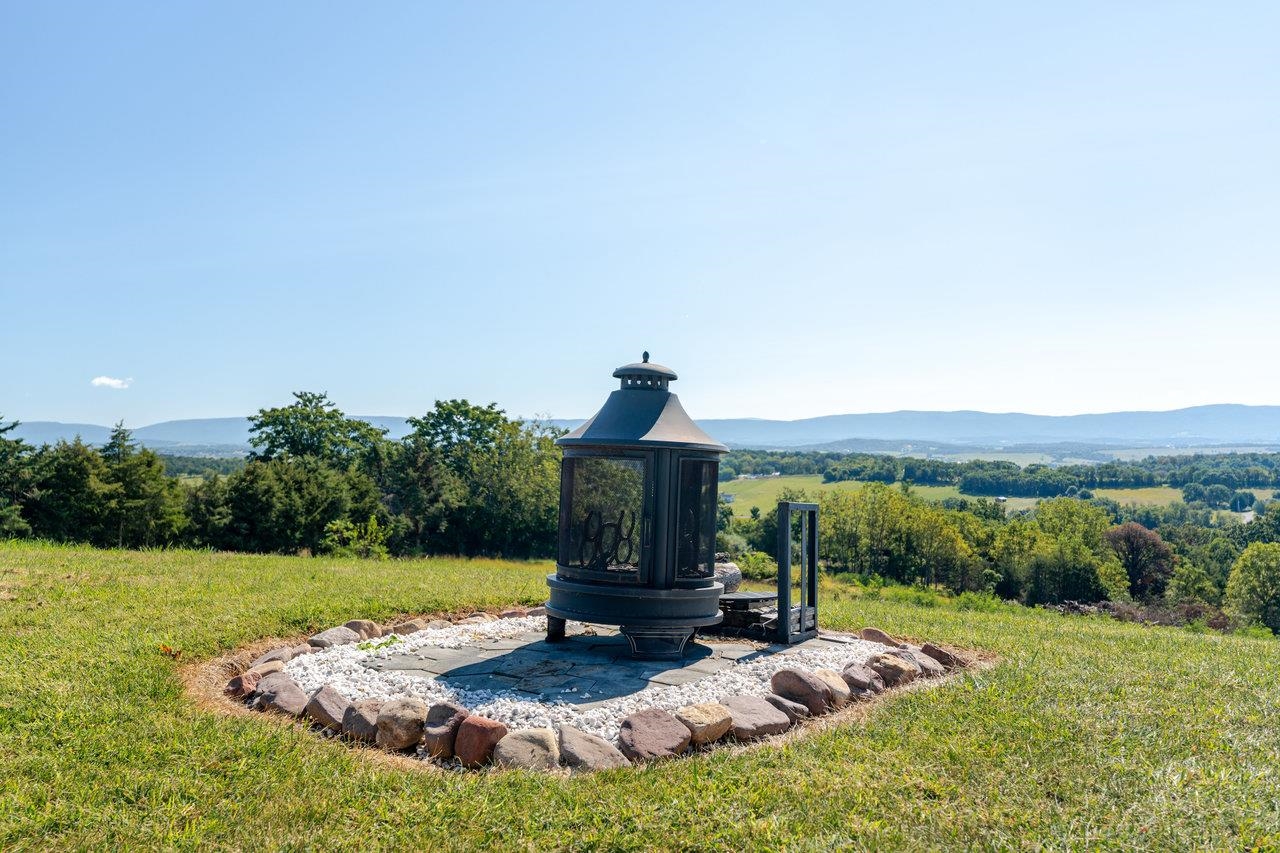 12012 Hollar School Road Linville, VA 22834 - Photo 29 of 75 a view of a house with backyard sitting area and garden